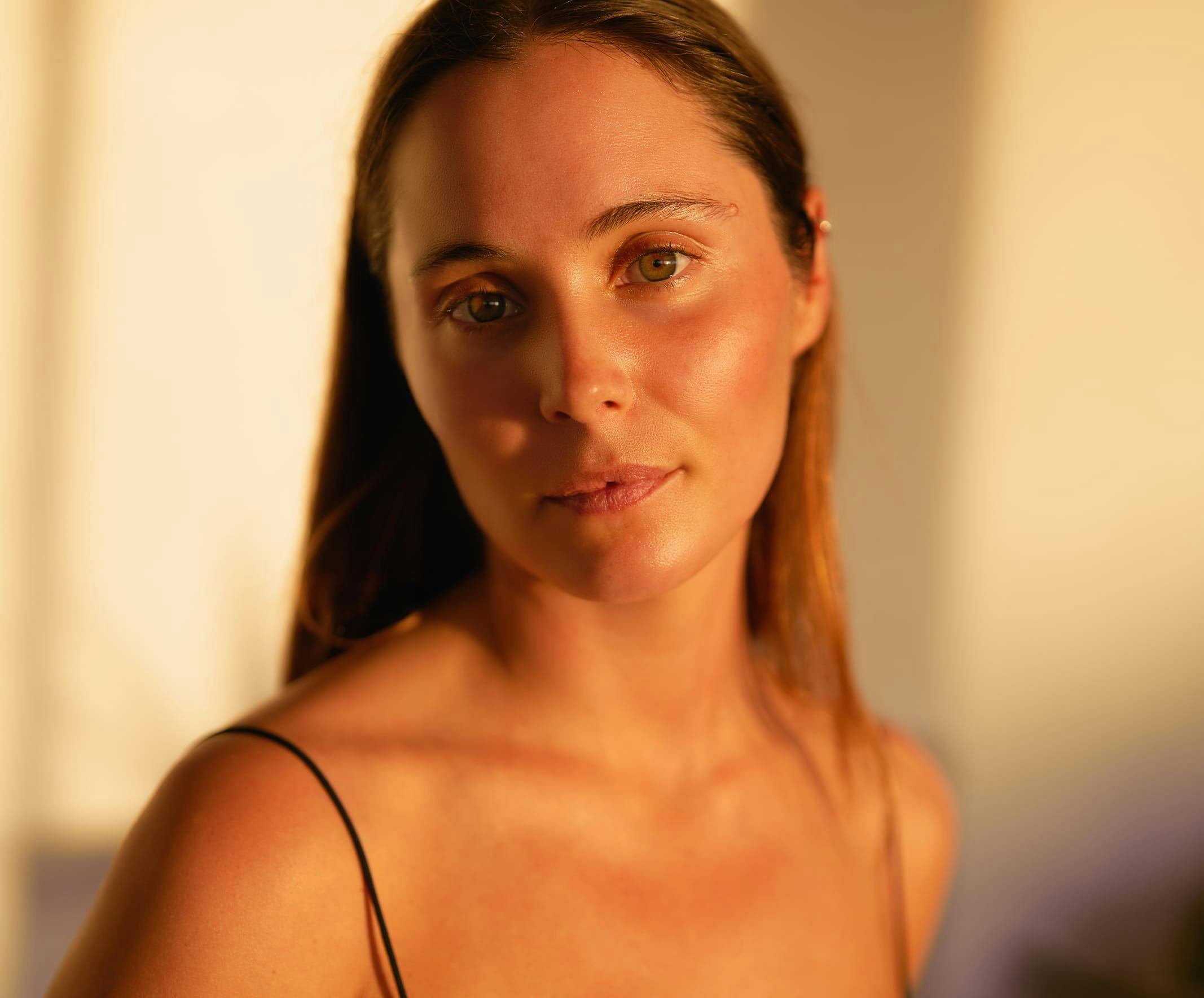 woman smiling in warm lighting