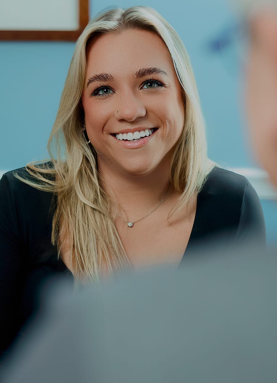 woman with blonde hair smiling