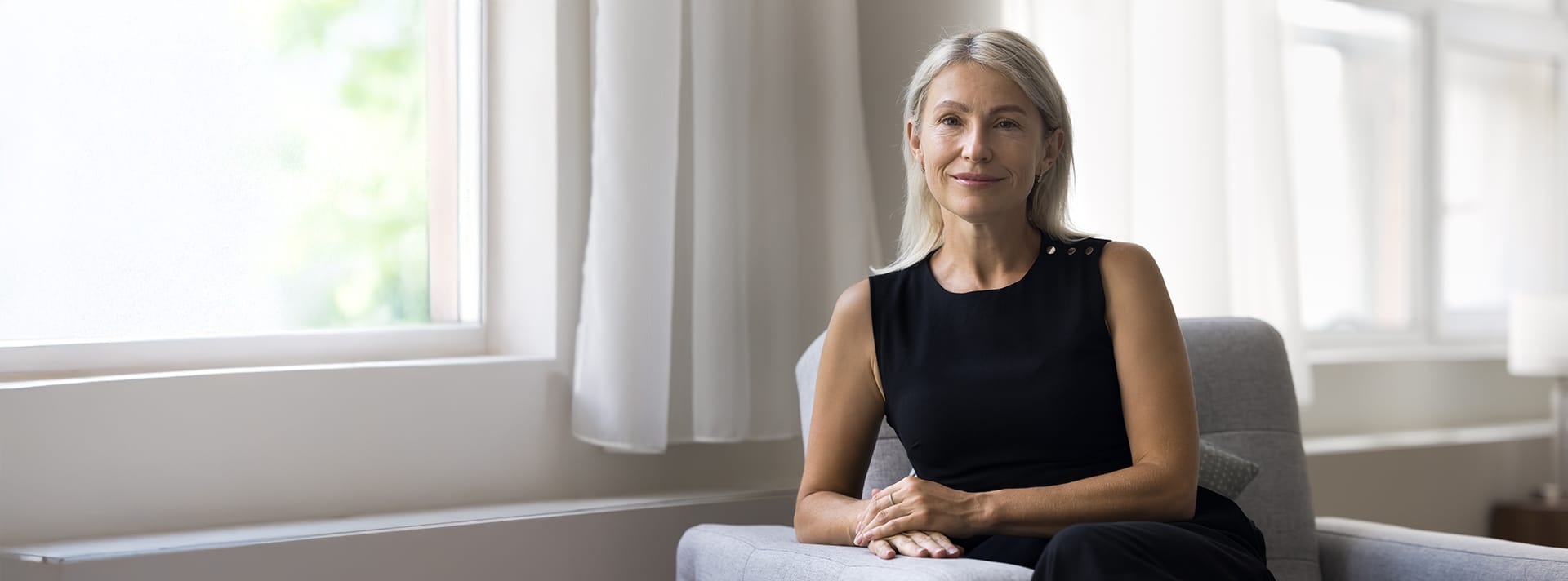 woman sitting in an arm chair