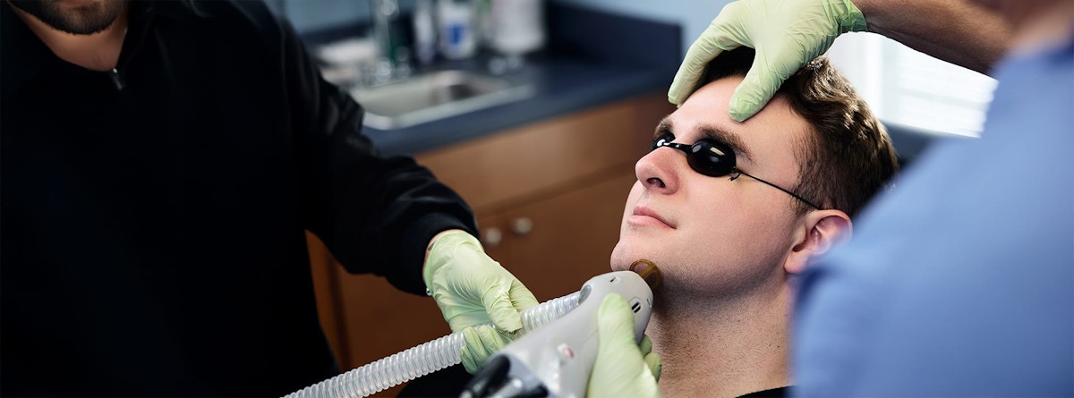 man getting laser hair removal procedure