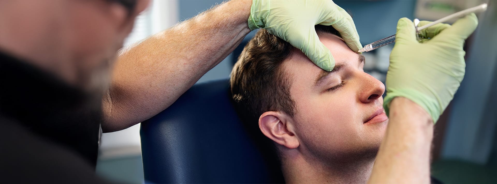 client getting injected in his forehead