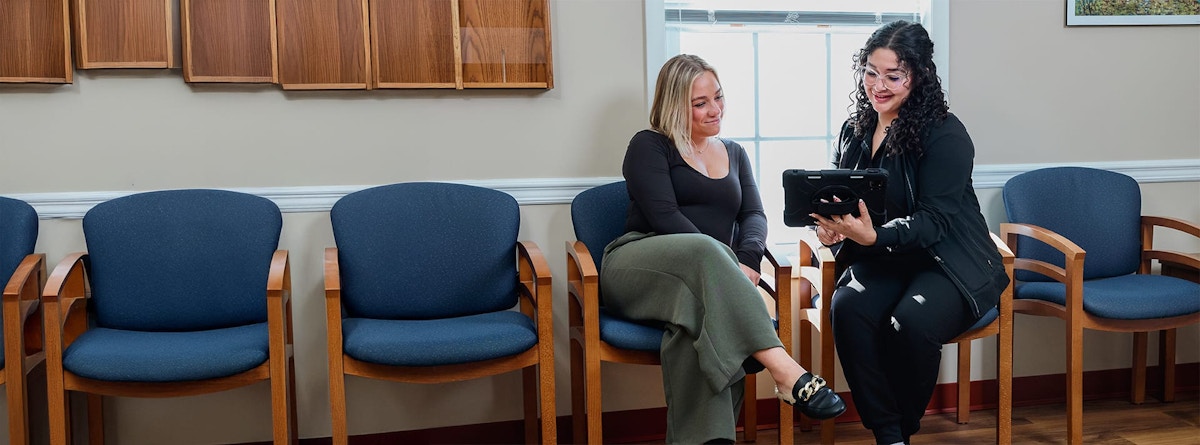 patient talking to receptionist