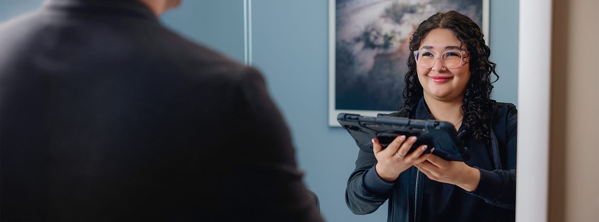 woman holding a tablet