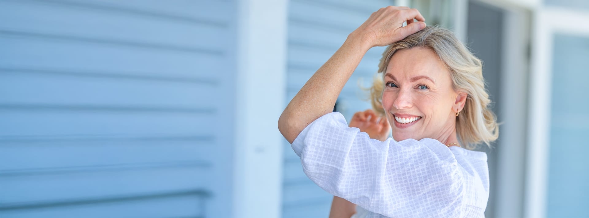 woman with her arms up