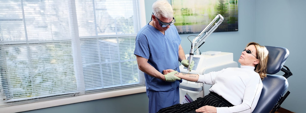 doctor removing a patient's tattoo