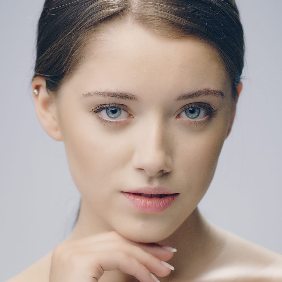 woman touching her chin