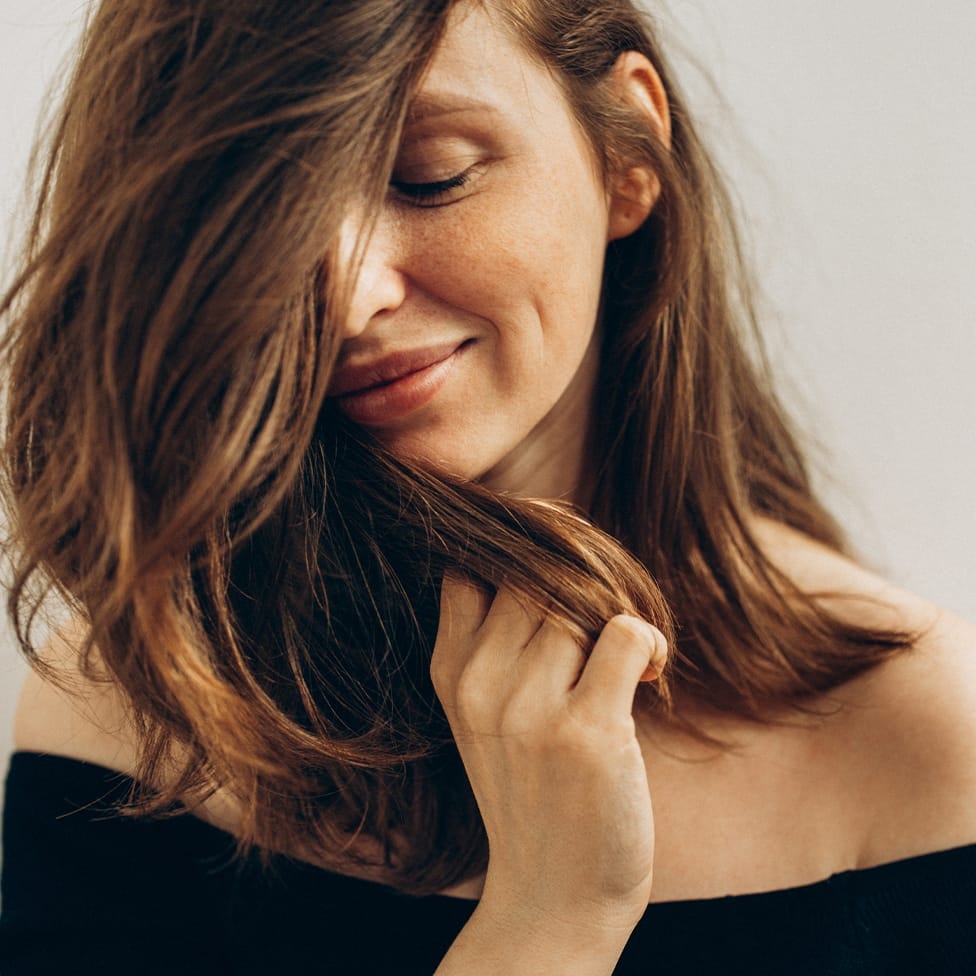 woman playing with her hair