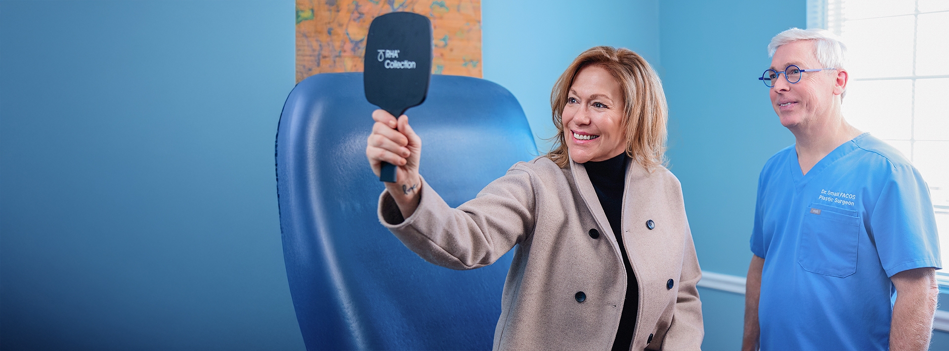 woman looking at her face in a handheld mirror