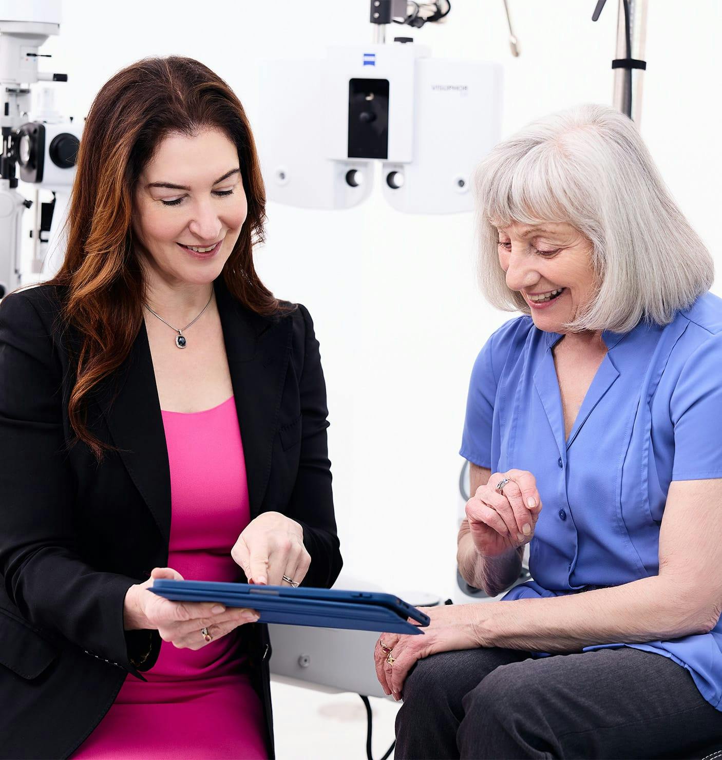 doctor showing a patient a tablet