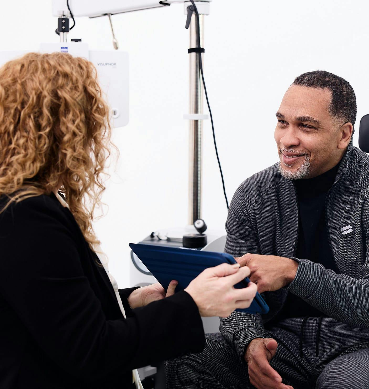 doctor showing a patient a tablet