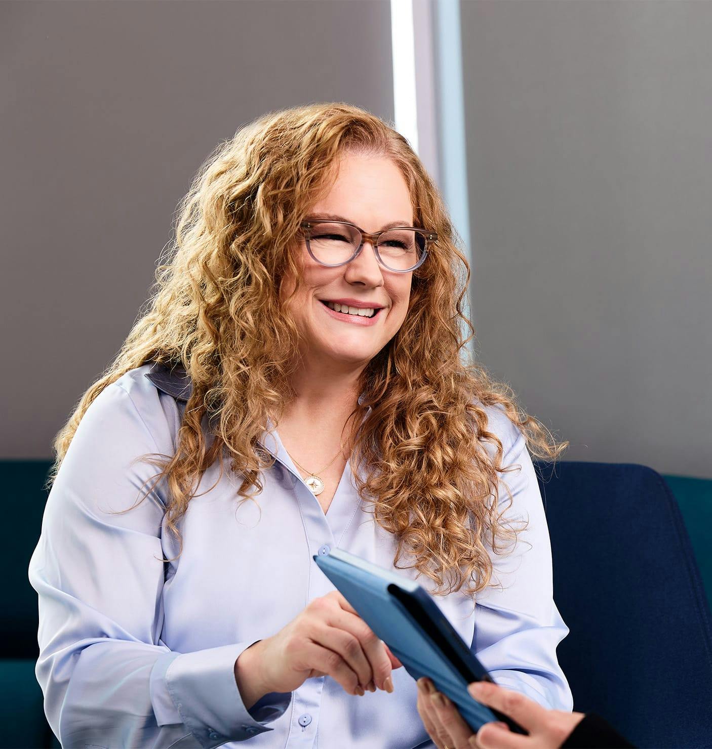 woman holding a tablet