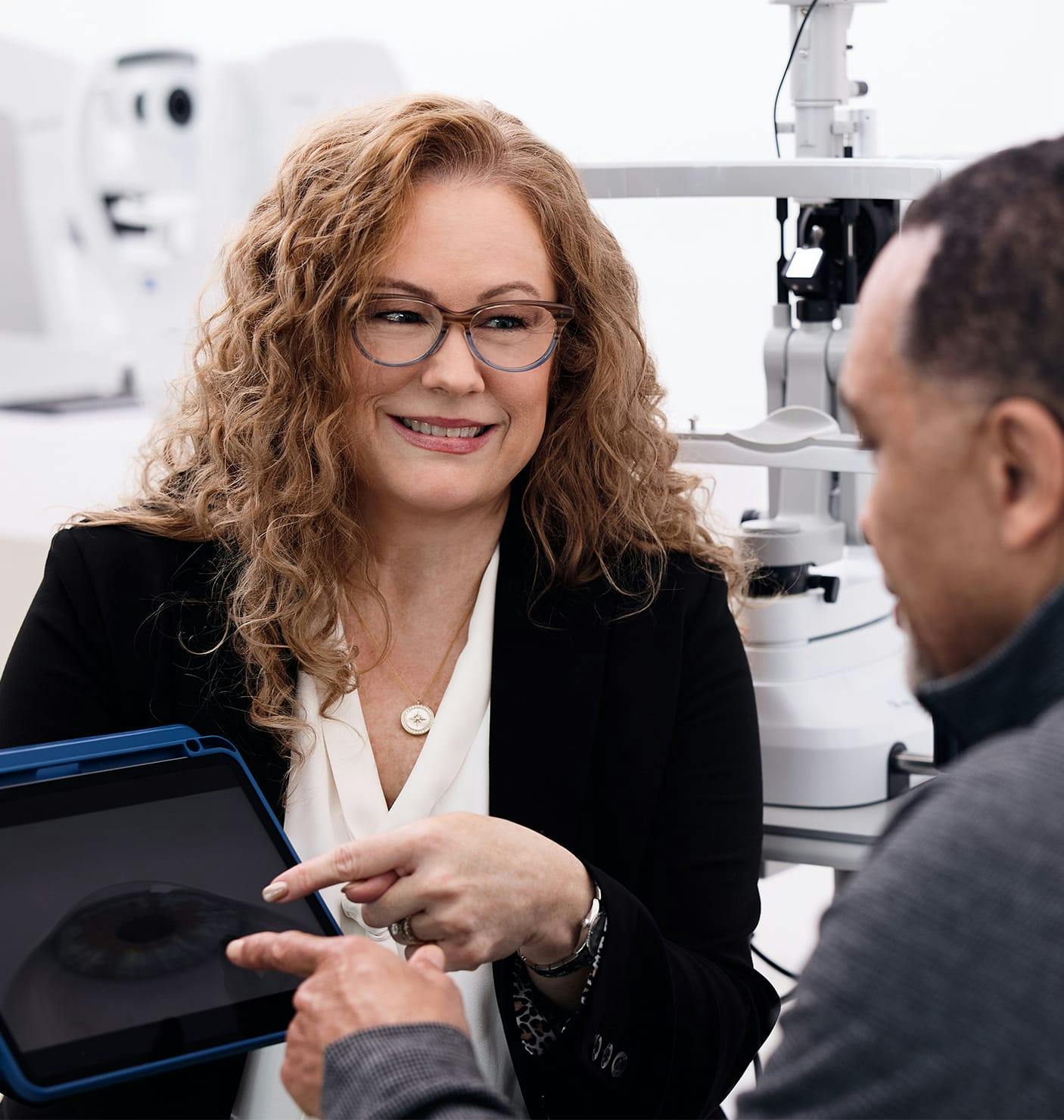 doctor showing a patient something on a tablet