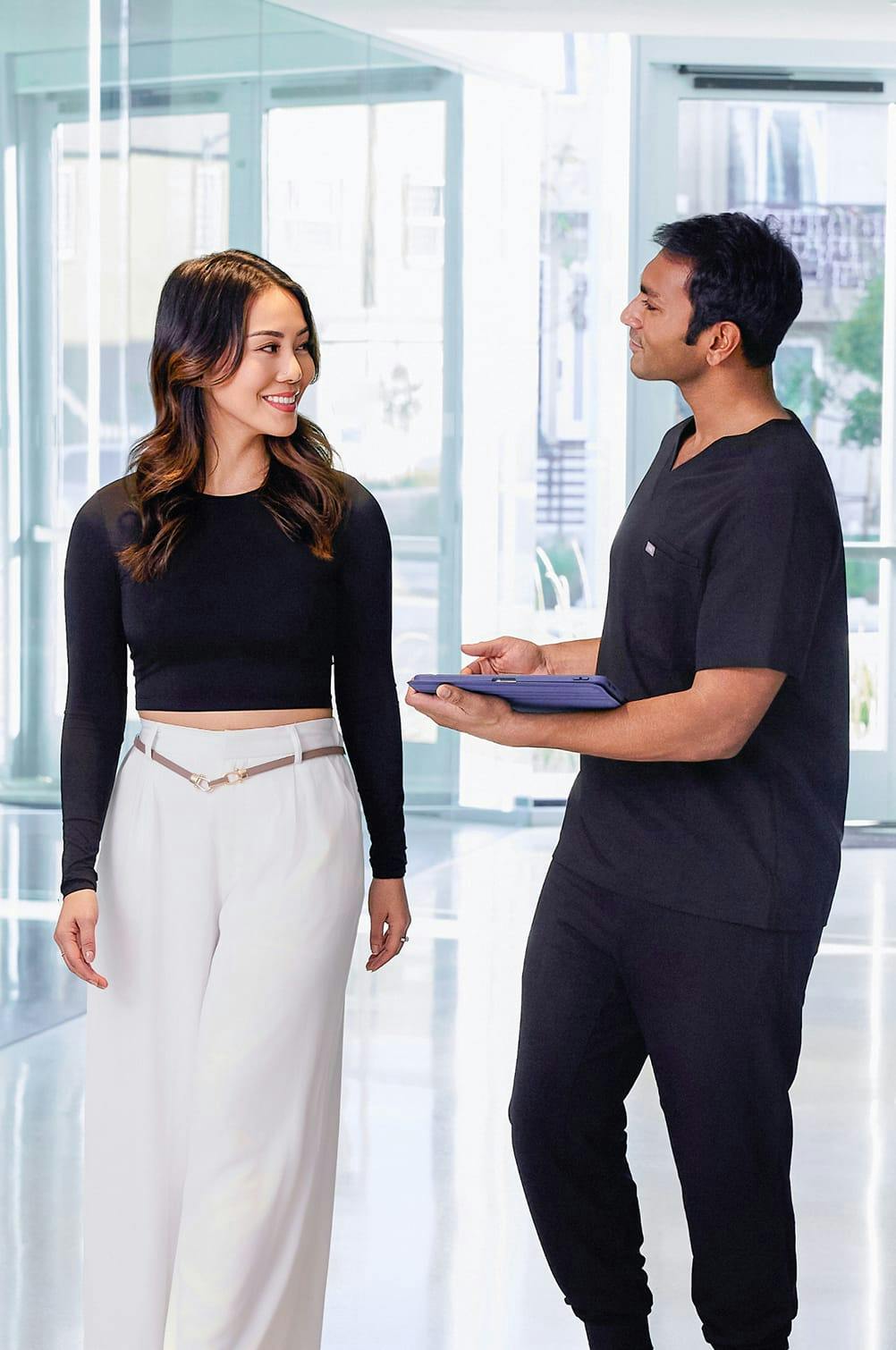 A patient with a worker at Precision Vision Bellevue