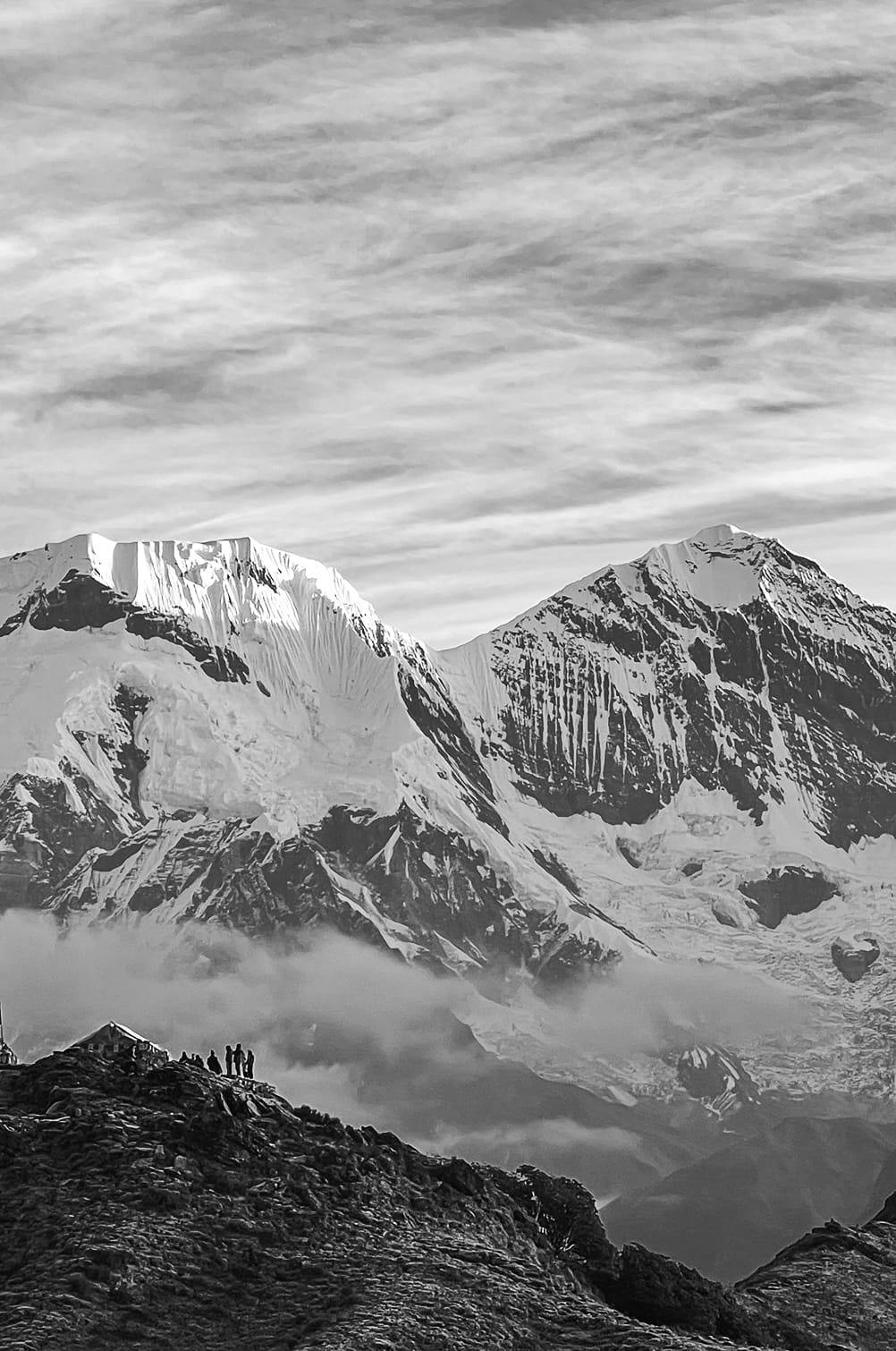 Black and white image of mountains with snow