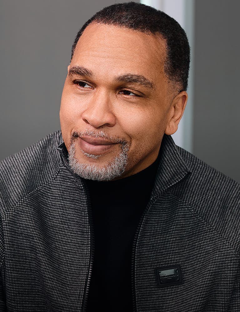 Man looking to the side and smiling