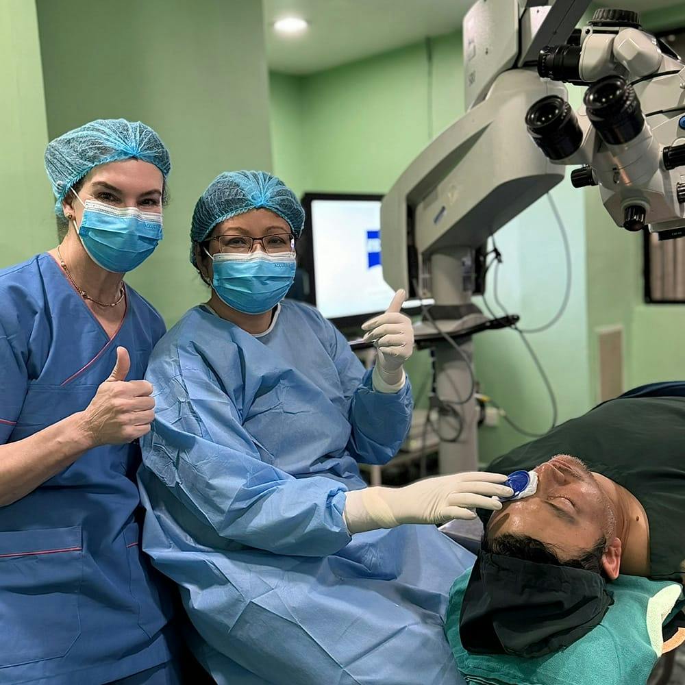 a doctor and a nurse working on a patient