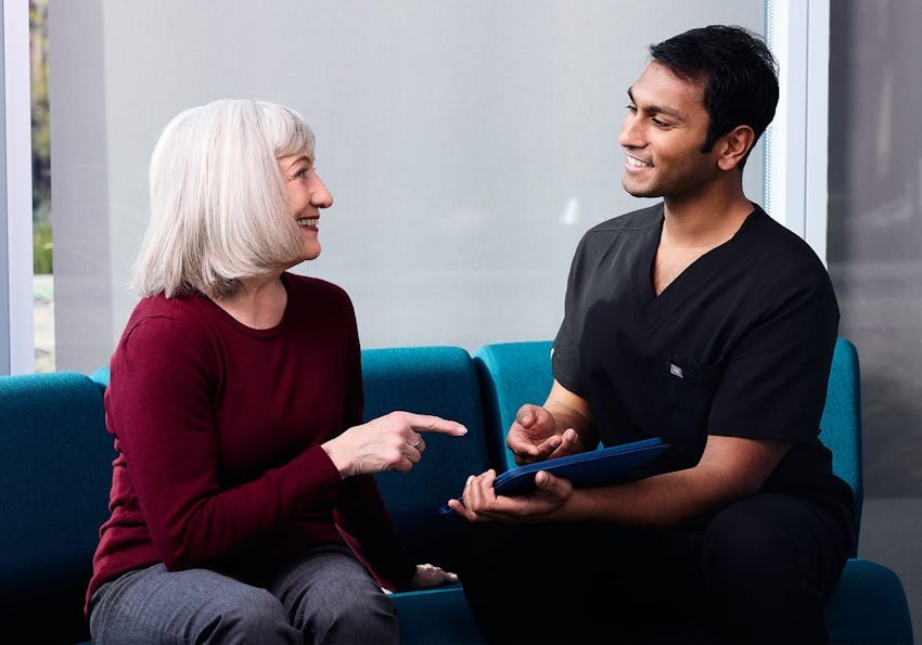 doctor pointing to a 3D model of an eye
