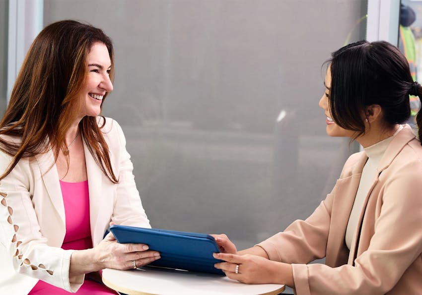 doctor showing a patient a tablet