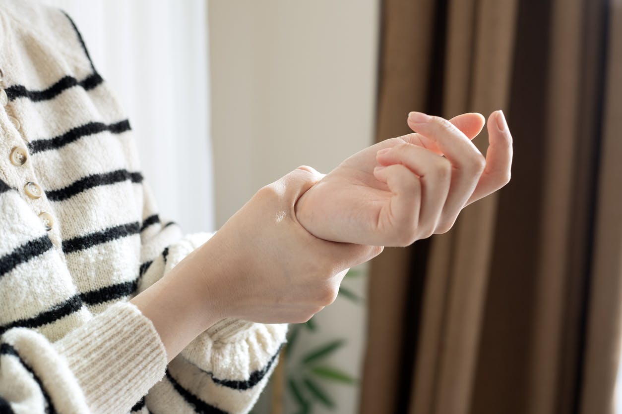 someone holding their wrist