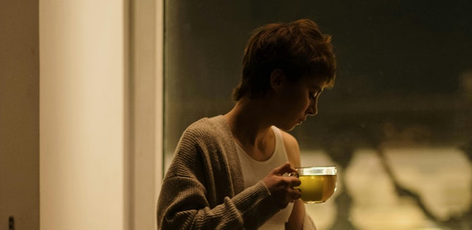 Woman with tea preparing for sleep