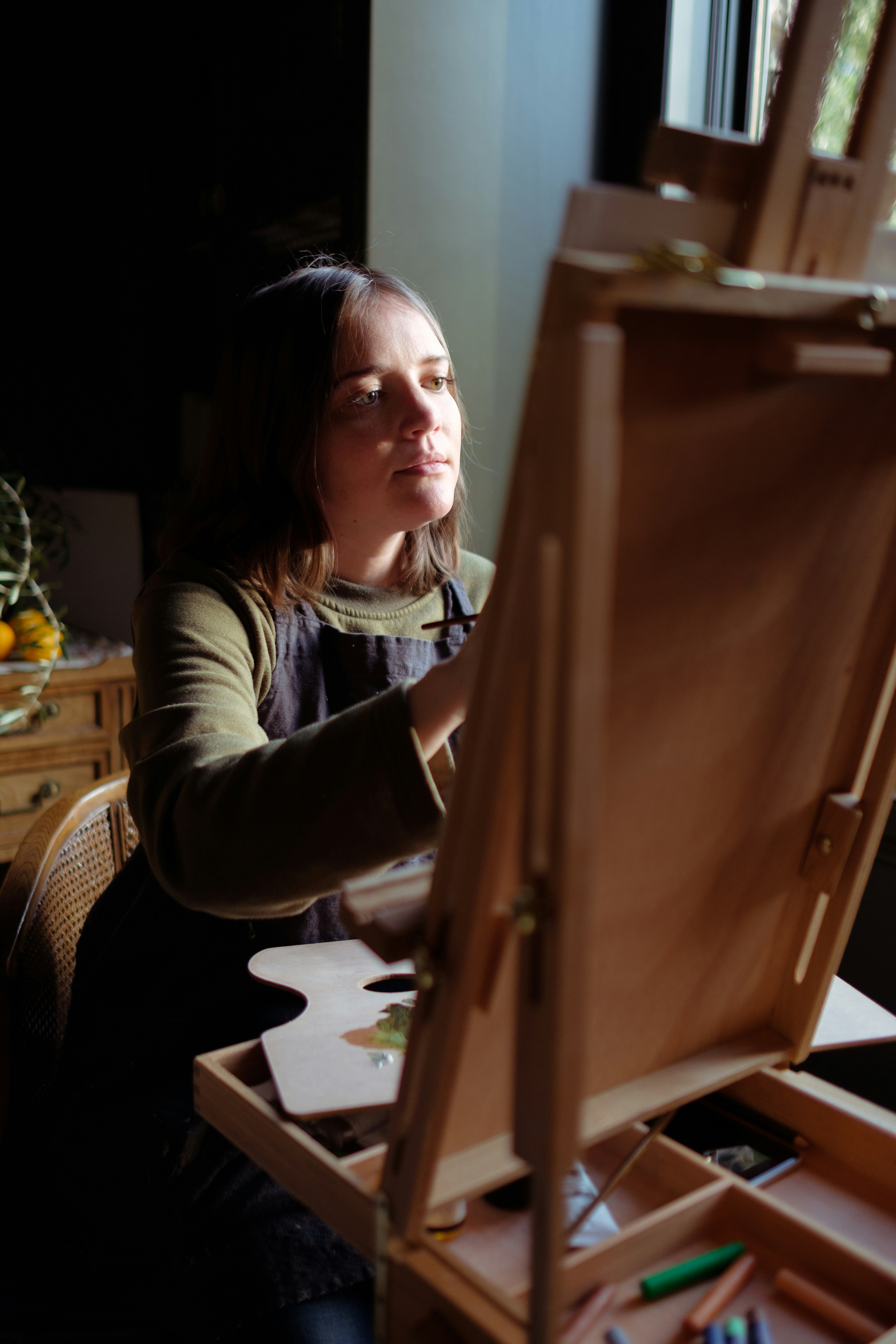 Woman Painting at Easel
