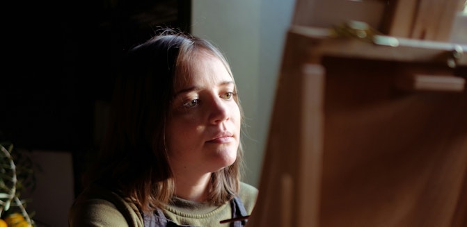 Woman Painting at Easel