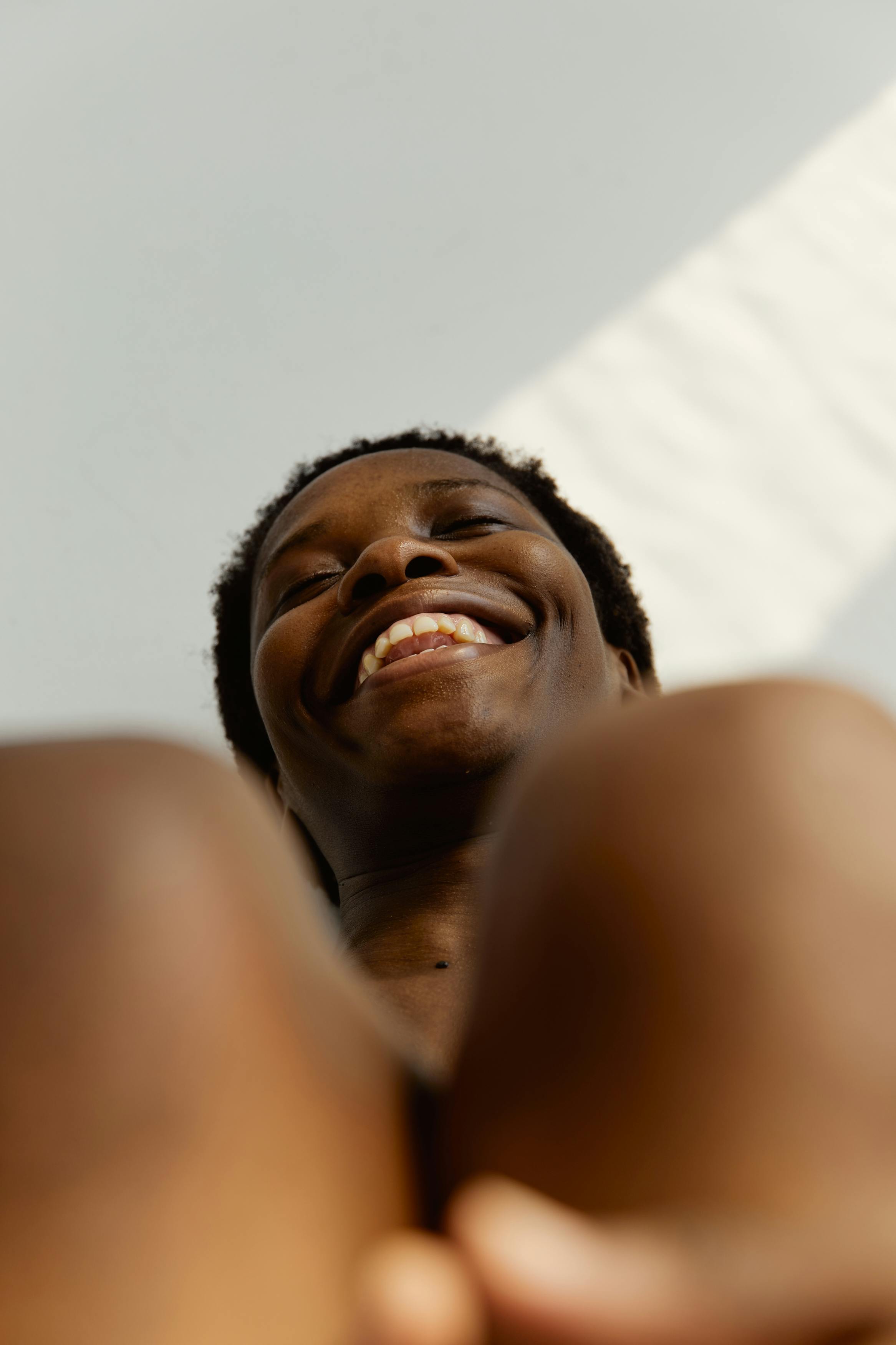 Woman laughing, shot from below