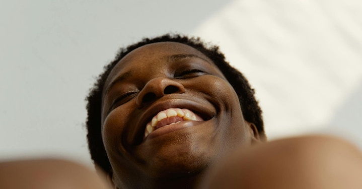 Woman laughing, shot from below