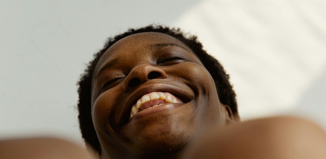Woman laughing, shot from below