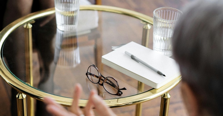 Patient and psychiatrist talk about treatment options and psychiatric costs