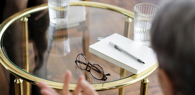 Patient and psychiatrist talk about treatment options and psychiatric costs