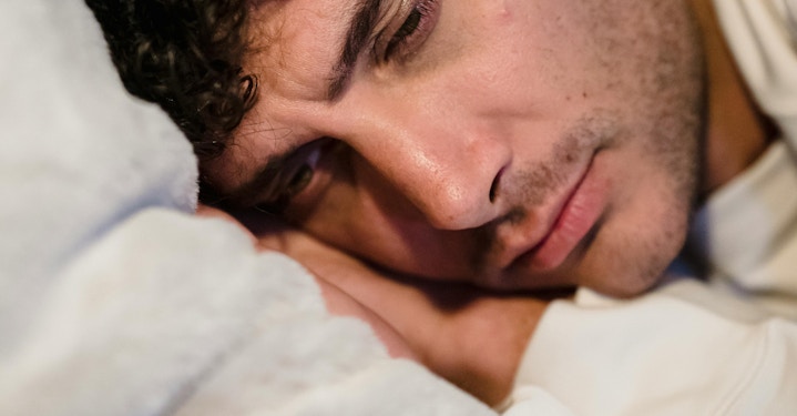 Person potentially contemplating sobriety while resting on a pillow