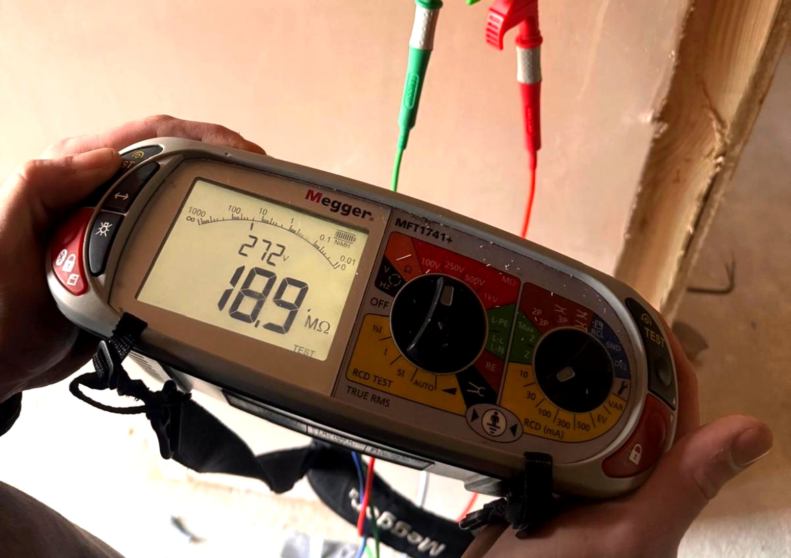 Flare EFS engineer testing a circuit with a Megger multifunction tester during electrical fault finding