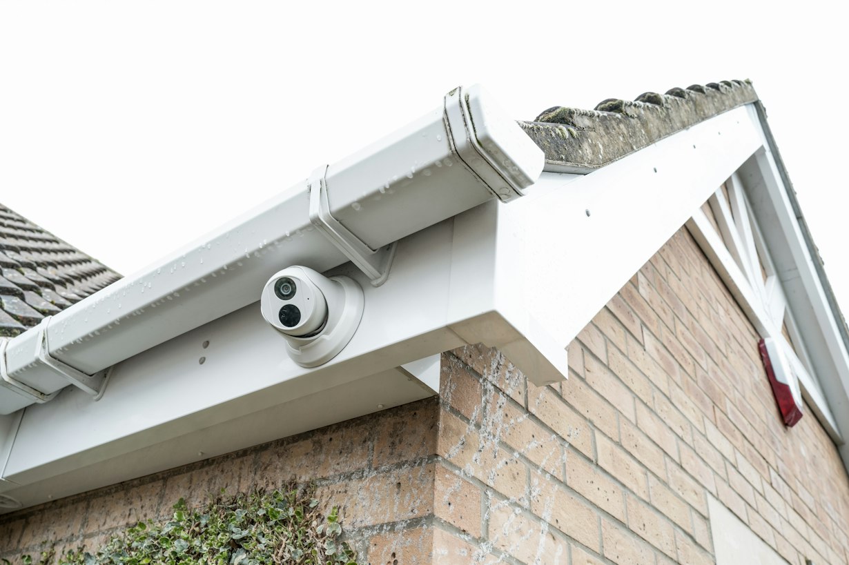 CCTV dome camera installed under the eaves of a house