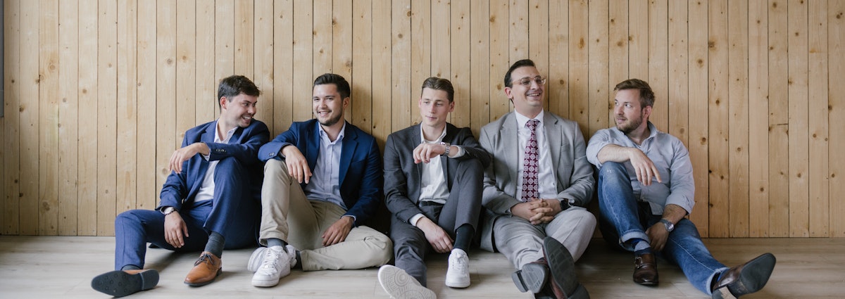 Colleagues Working Together Sitting In Tiles