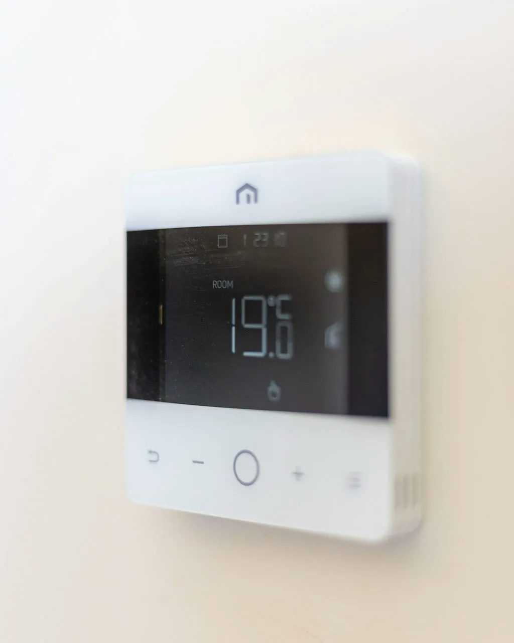 A thermostat set to 19 degrees
