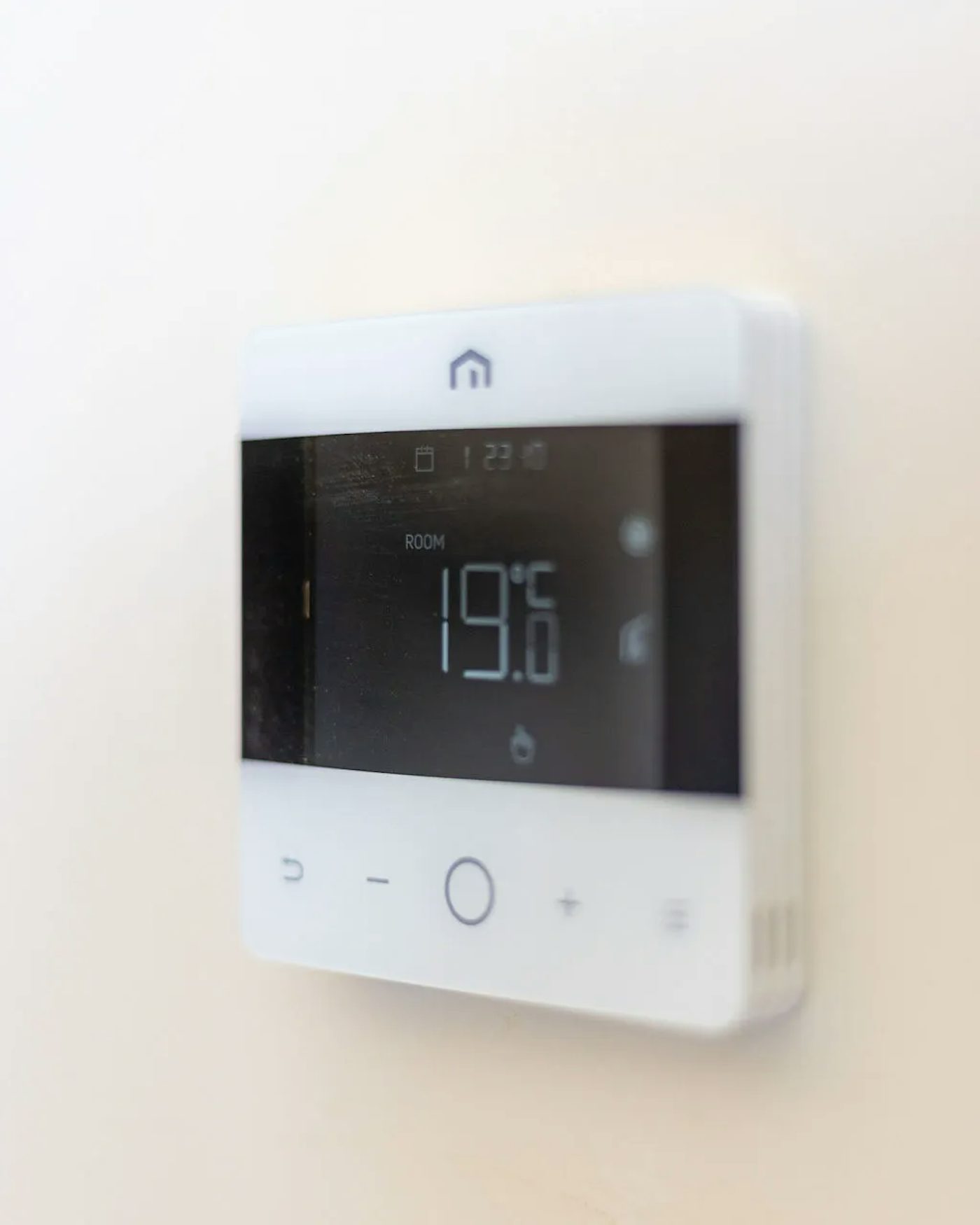 A thermostat set to 19 degrees