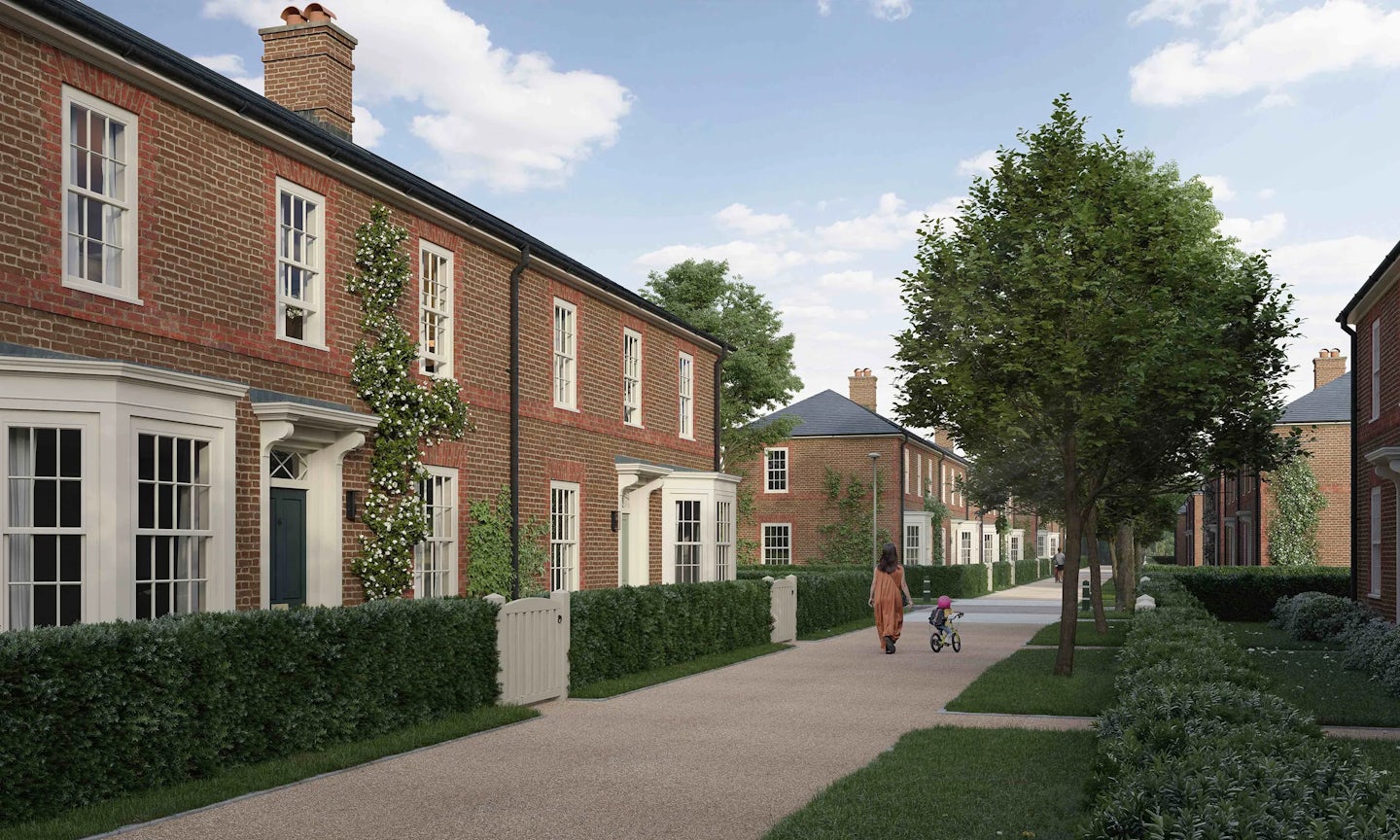 CGI of Welborne Garden Village. A quiet residential street lined with brick houses, neatly trimmed hedges, and a paved walkway. Trees add greenery to the scene, and a person walks alongside a child riding a tricycle. The houses feature white-framed windows and doors, with some displaying climbing plants on their walls.