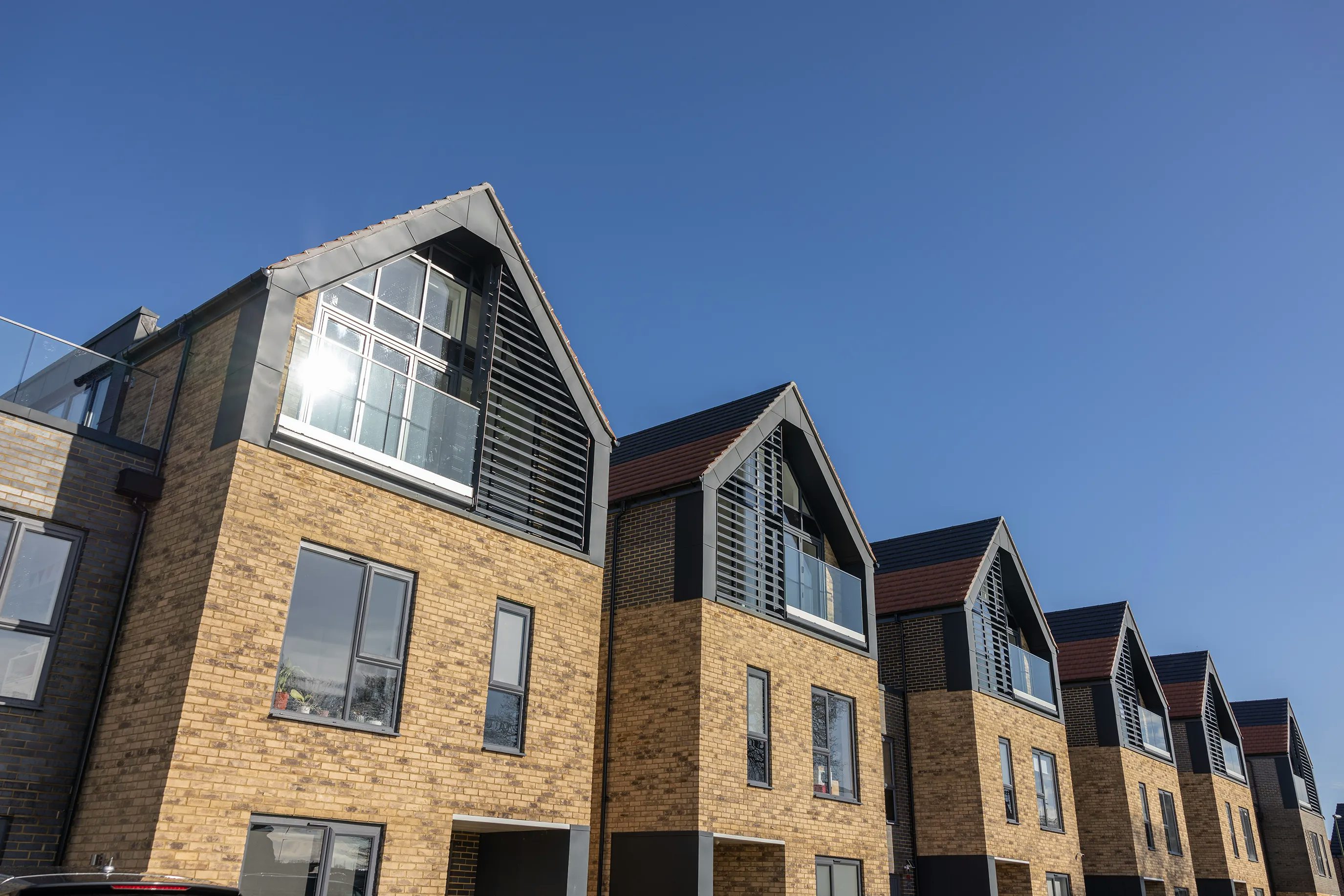 A row of nordic style villas by Thakeham at Woodgate at Pease Pottage.
