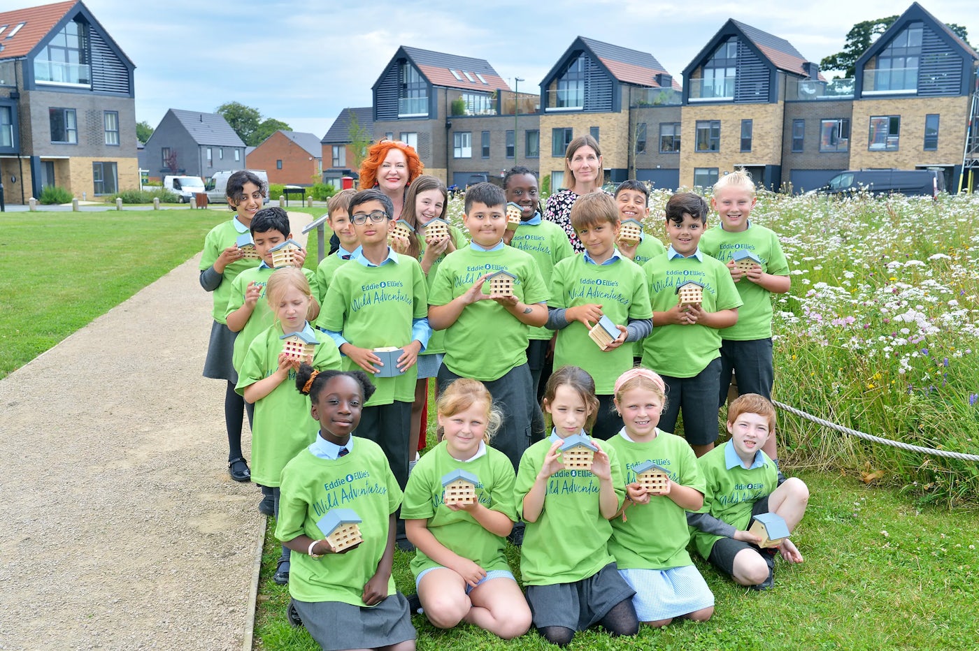 A group of children from Woodgate Primary Academy take part in an Eddie and Ellie activity to create bee hotels.