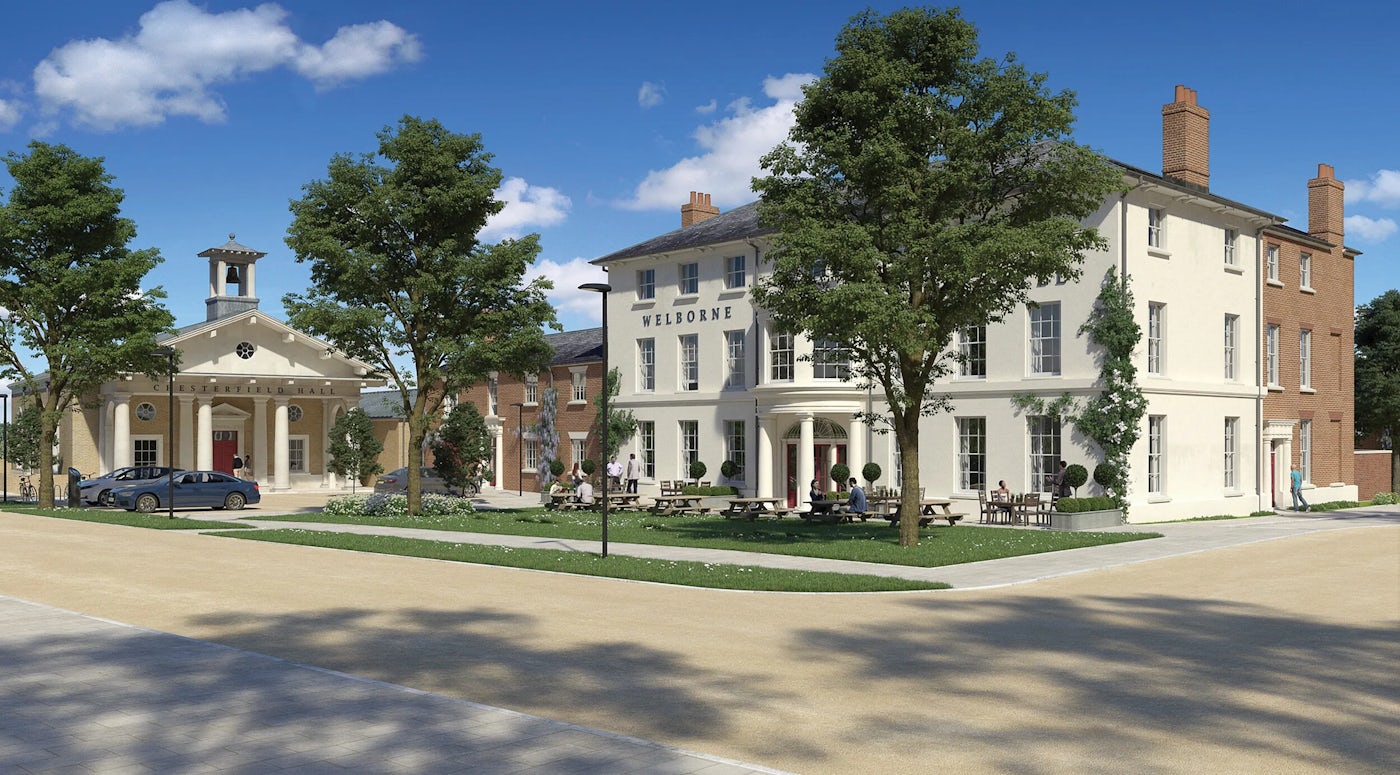 A street scene featuring a well-maintained public space with trees, green grass, and a paved walkway under a bright blue sky with scattered clouds. In the center, a building labeled "WELBORNE" appears to be a hotel or similar establishment, with outdoor seating where people are gathered. To the left, a smaller building with a clock tower stands near parked cars.
