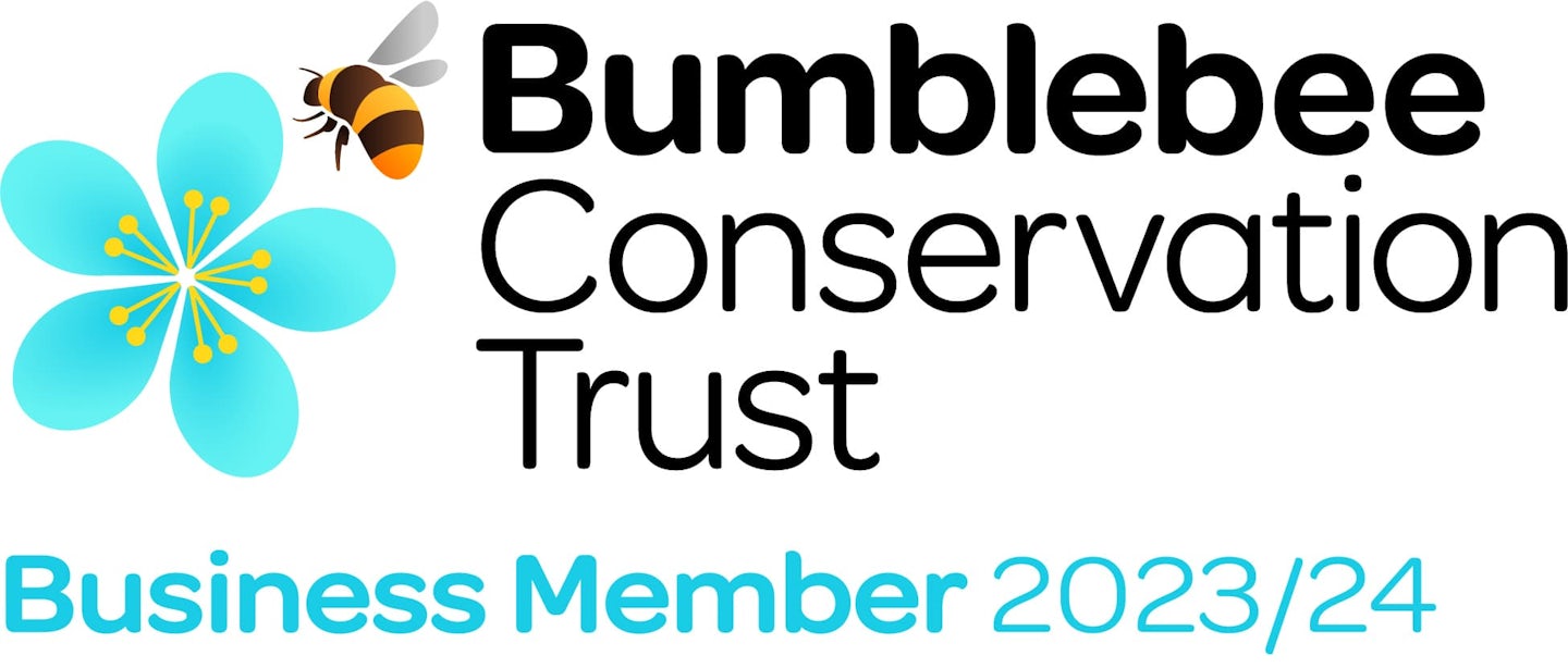 The Bumblebee Conservation Trust logo features a stylized graphic of a bee alongside a blue flower. The text reads "Bumblebee Conservation Trust" and "Business Member 2023/24," indicating membership in an organization dedicated to bumblebee conservation.