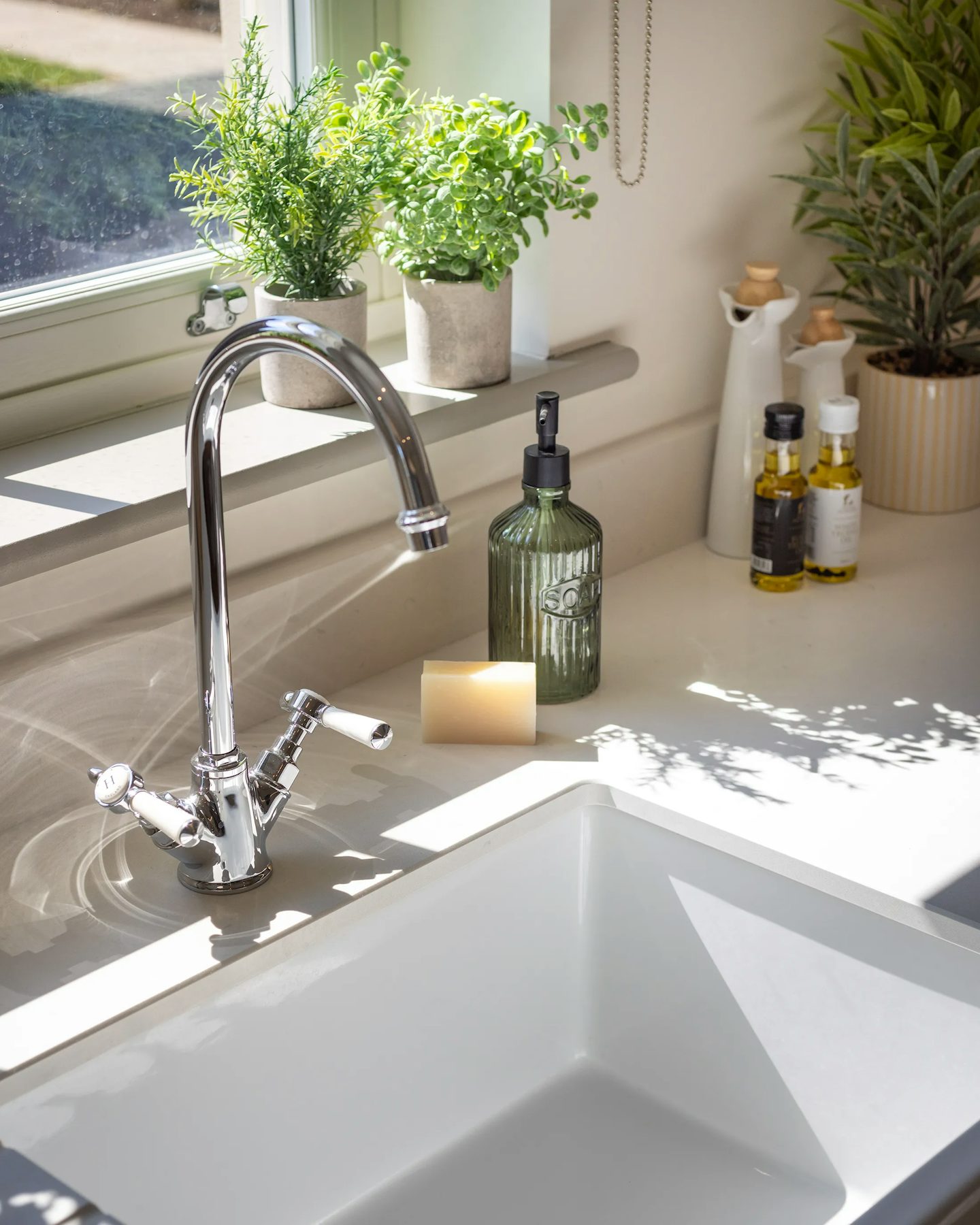 Close up shot of a kitchen sink, premium appliances in the Kensington showhome at Welborne Garden Village.