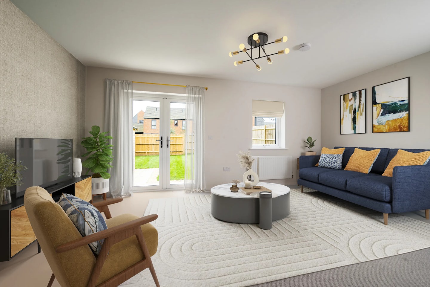 A bright, contemporary living room with a blue sofa accented by yellow and blue cushions, facing a round coffee table with decorative objects. A beige armchair with a patterned cushion sits nearby. The space features a flat-screen TV on a wooden stand, two abstract art prints above the sofa, and several potted plants adding greenery. A large window with sheer curtains reveals a fenced garden, and a white textured rug softens the wooden floor beneath a modern ceiling light. Let me know if you'd like a version tailored to a specific tone, platform, or audience—happy to iterate.