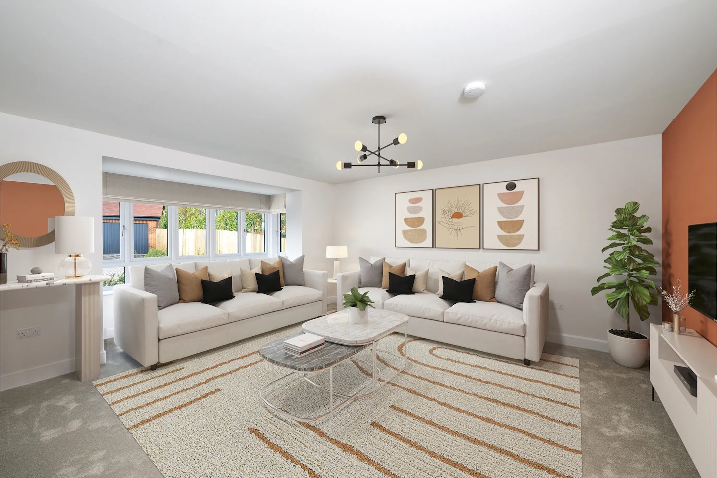 Modern living room with two white sofas featuring black, brown, and beige cushions, arranged around a white marble coffee table topped with books and a potted plant. A burnt orange accent wall holds two abstract artworks above the sofas. A large window reveals greenery, while a round mirror and table lamp sit on a console to the left. A patterned rug anchors the space, and a distinctive chandelier hangs overhead. To the right, a white TV stand and tall green plant complete the inviting, contemporary setting.