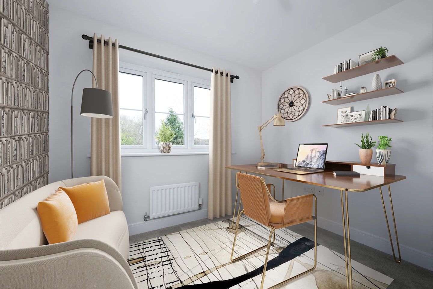 A bright, modern home office with a beige sofa accented by yellow cushions on the left, and a wooden desk on the right holding a laptop, books, and a potted plant. Above the desk are two shelves displaying books and decorative items. A large wall clock hangs above the desk, while a window with beige curtains lets in natural light. A floor lamp stands beside the sofa, and a patterned rug anchors the space.