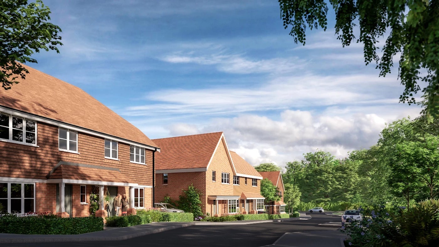 CGI of a row of brick houses with red-tiled, pitched roofs lines a quiet residential street under a blue sky with scattered clouds. Cars are parked along the curb, and lush greenery—including trees and neatly trimmed shrubs—frames the scene, evoking a calm, well-kept neighborhood.