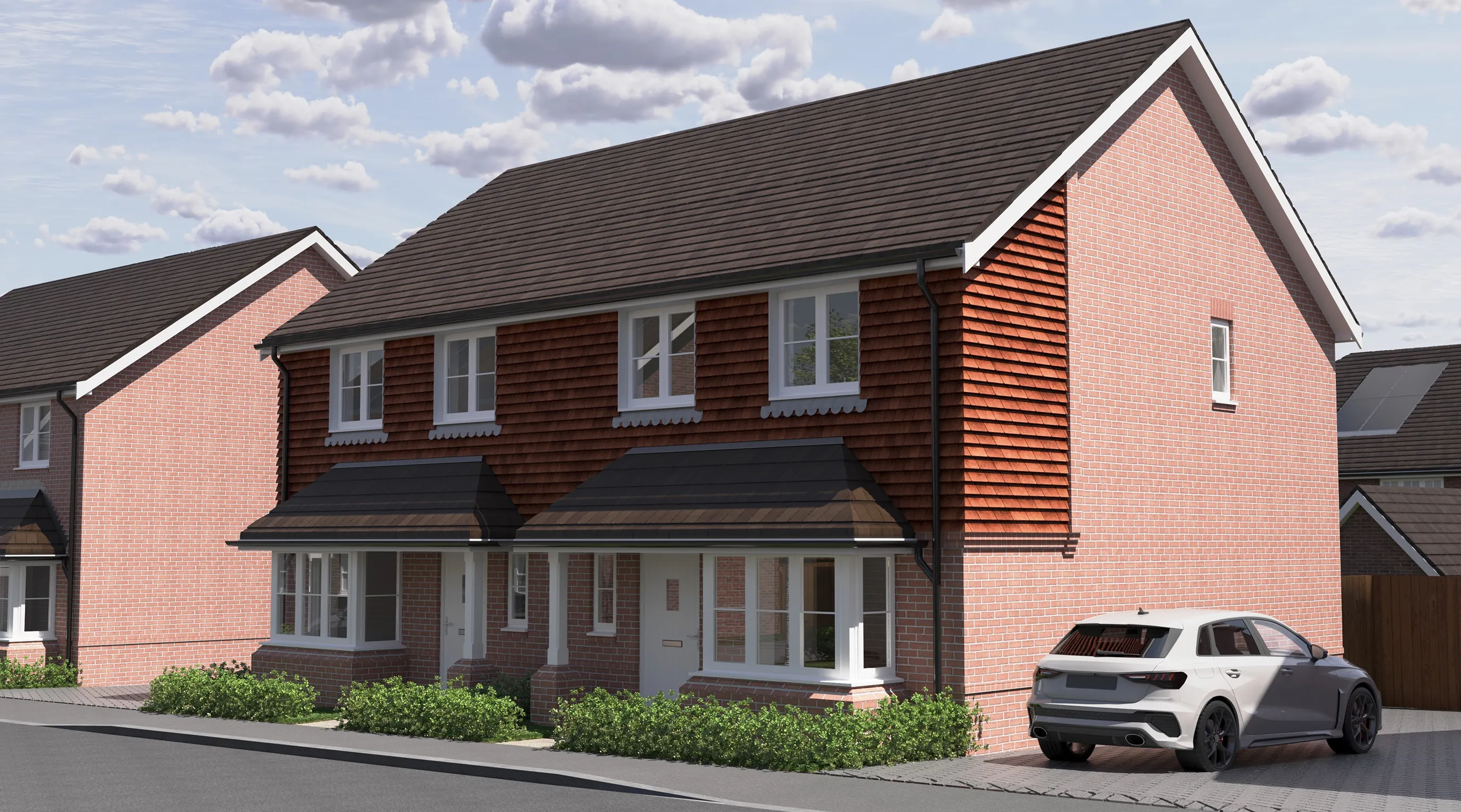 CGI of two semi-detached red brick homes with dark grey pitched roofs and white-framed windows, set along a quiet residential street. One home features a white car parked in a paved driveway. Small shrubs line the front gardens, and the partly cloudy sky lends a soft, temperate light to the peaceful suburban setting.