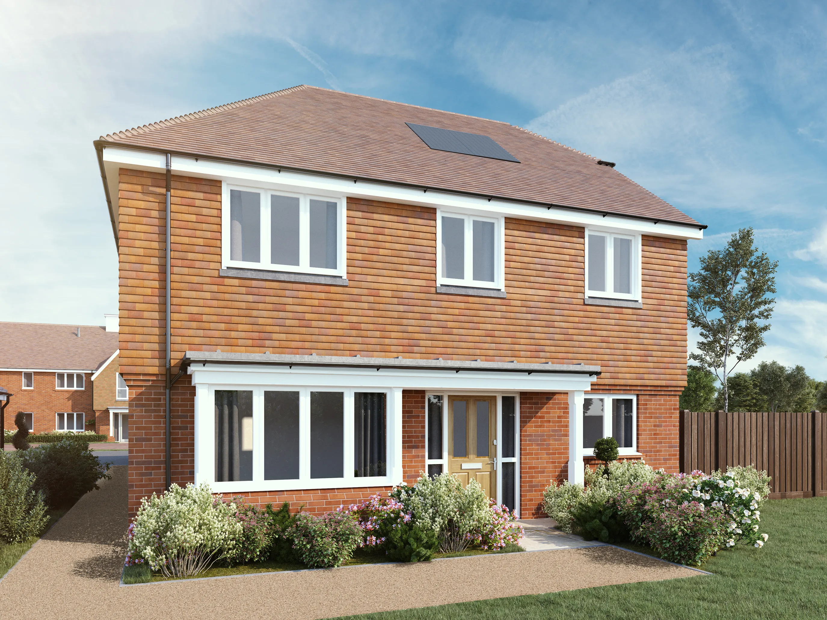 CGI of a two-story brick home with a pitched roof fitted with solar panels, emphasizing sustainable living. The facade features white-framed windows and a centered front door accessed via a short pathway flanked by manicured bushes. A vibrant front garden borders the lawn, showcasing flowering plants and neatly trimmed shrubs. The scene is bathed in bright daylight under a soft blue sky dotted with wispy clouds, highlighting the home's clean, eco-friendly appeal within a peaceful suburban setting