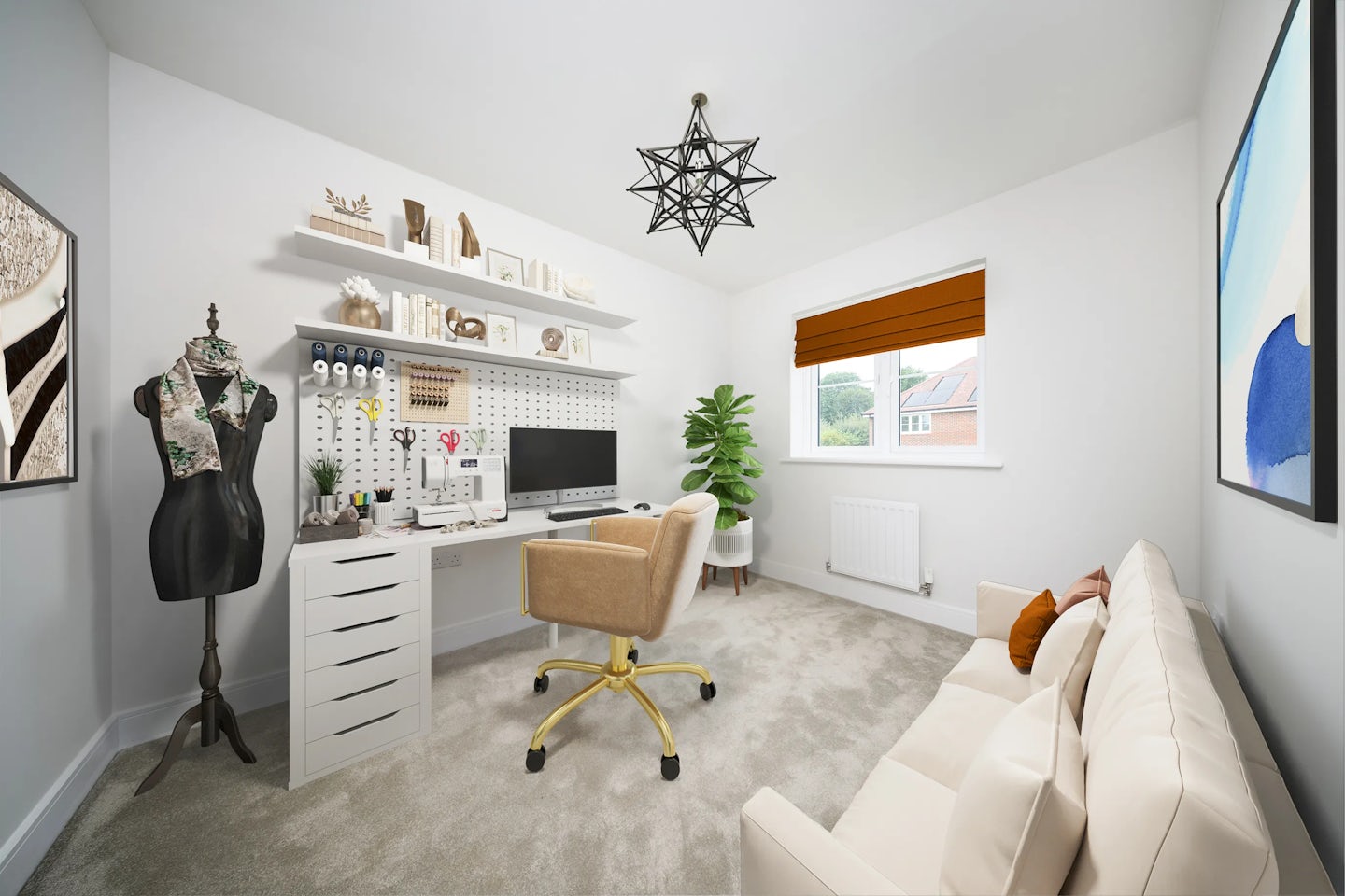 Creative home office or craft studio featuring a white desk with gold-accented drawers, topped with a computer monitor, potted plant, and organized supplies mounted on a pegboard. A mannequin draped with a scarf stands beside a cushioned beige swivel chair, suggesting textile work or design. Overhead shelves display books, storage boxes, and decorative pieces, adding personality and function. A sofa with patterned pillows sits under wall art, while an orange blind filters light from the window above the radiator. A geometric pendant light and soft carpeted flooring complete the warm, stylish, and purposeful ambiance